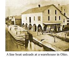 A line boat unloads at a warehouse